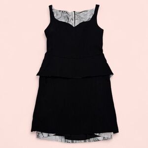 D. Exterior dress peplum peek a boo pleated marble print back